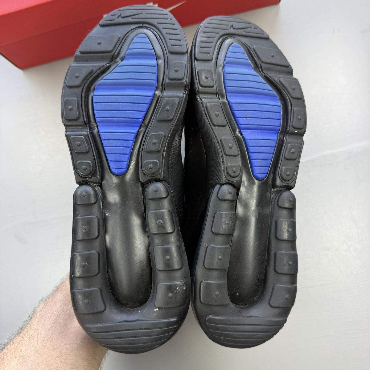 Nike black Air Max 270 trainers with Hyper Royal Blue accents and 'Just Do It' branding.