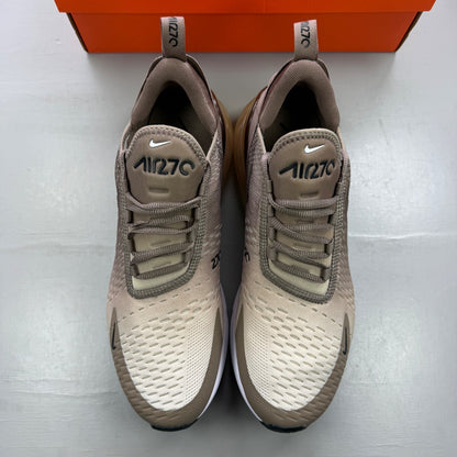 Nike brown trainers with Air Max cushioning and logo detail on the tongue.