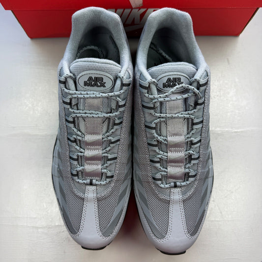 Nike Air Max 95 grey trainers with caution strip detailing and black accents.