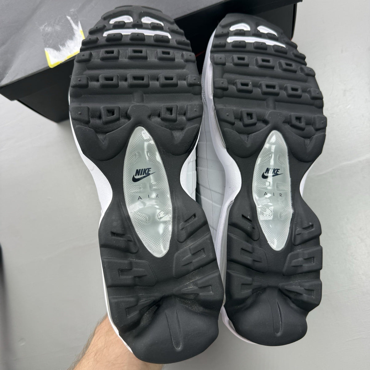 Nike Air Max 95 Ultra grey trainers with black and white accents, mesh and leather material.
