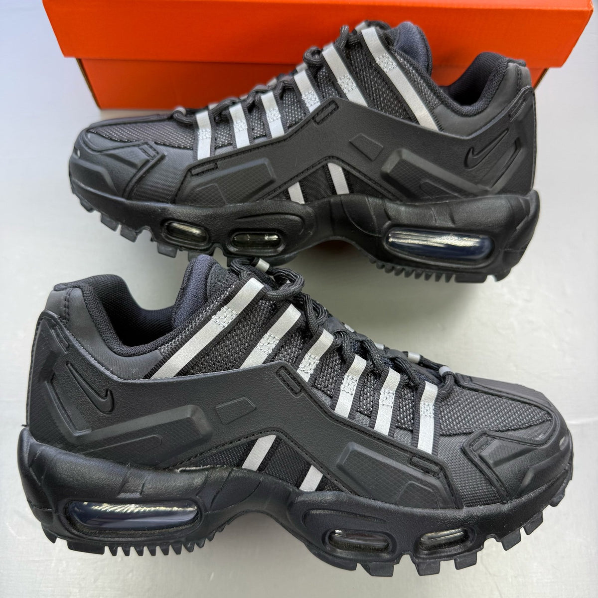 Nike Air Max 95 NDSTRKT black trainers with reflective detailing and logo accents.