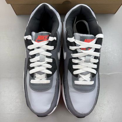 Nike Air Max 90 grey trainers with leather upper and signature swoosh logo.