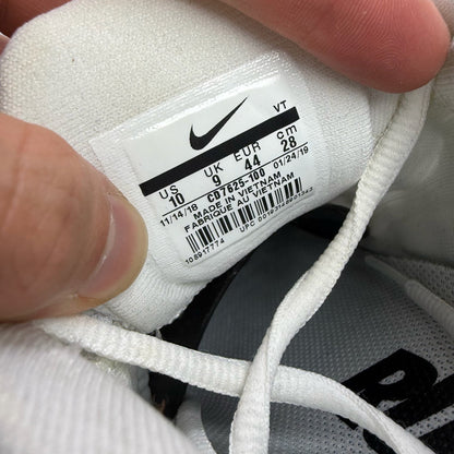 Nike Air Max 2015 white running shoes with black accents and logo detail.