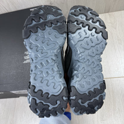 Nike React Vision black trainers with safety orange accents and unique design details.
