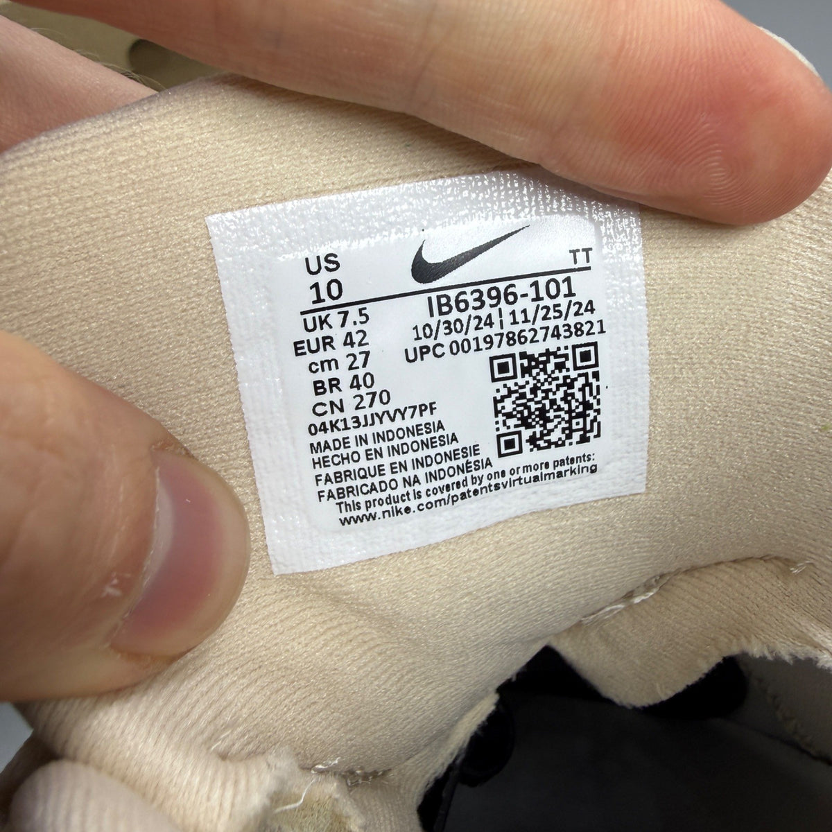 Nike trainers white with big bubble sole and iconic swoosh logo.