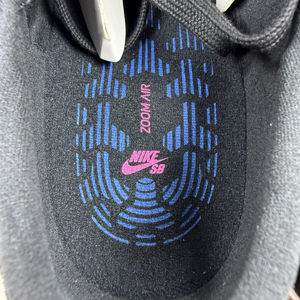 Nike black SB Zoom Stefan Janoski RM sneakers with white logo and sleek design.