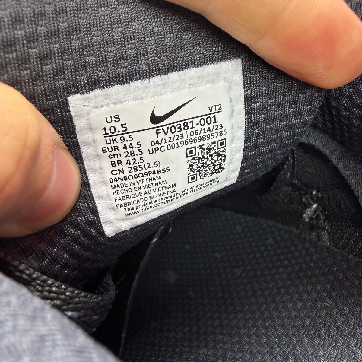 Nike grey trainers with reflective swoosh logo and anthracite detailing.