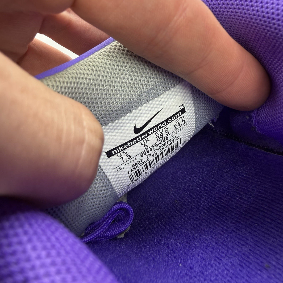 Nike trainers purple with silver accents and distinctive Shox cushioning system.