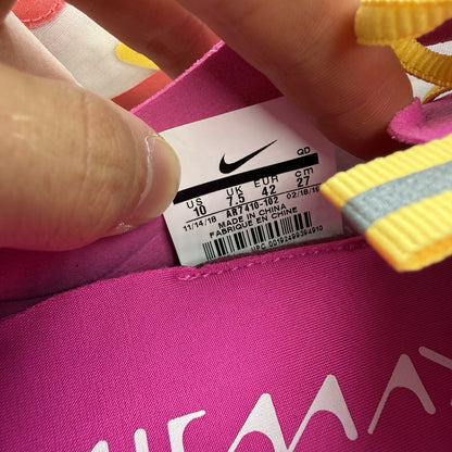 Nike Air Max Dia SE white trainers with laser fuchsia and gold accents, sleek design.