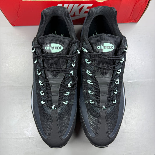 Nike running shoes black with mint foam accents and anthracite detailing.