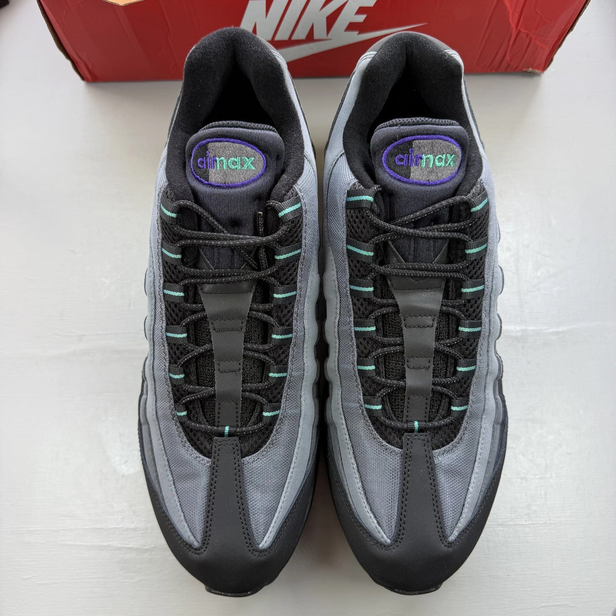 Nike Air Max 95 black sneaker with big bubble design and grape dusty cactus accents.