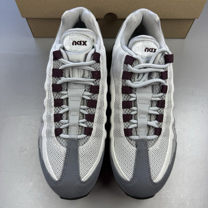 Nike Air Max 95 OG Big Bubble grey sneakers with burgundy accents and visible air cushioning.