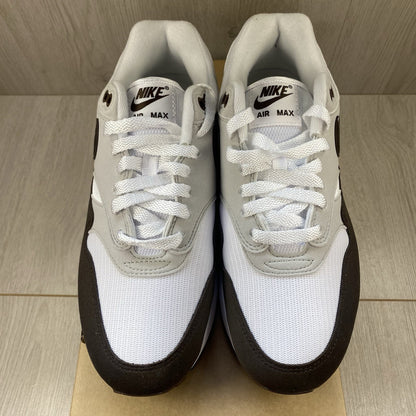 Nike Air Max 1 '87 trainers white with grey accents and brown detailing.