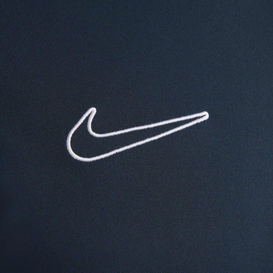 Nike blue Dri-FIT 1/4 zip top with logo and breathable material.
