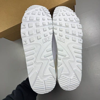 Nike white trainers leather upper with Air Max cushioning and classic logo details.