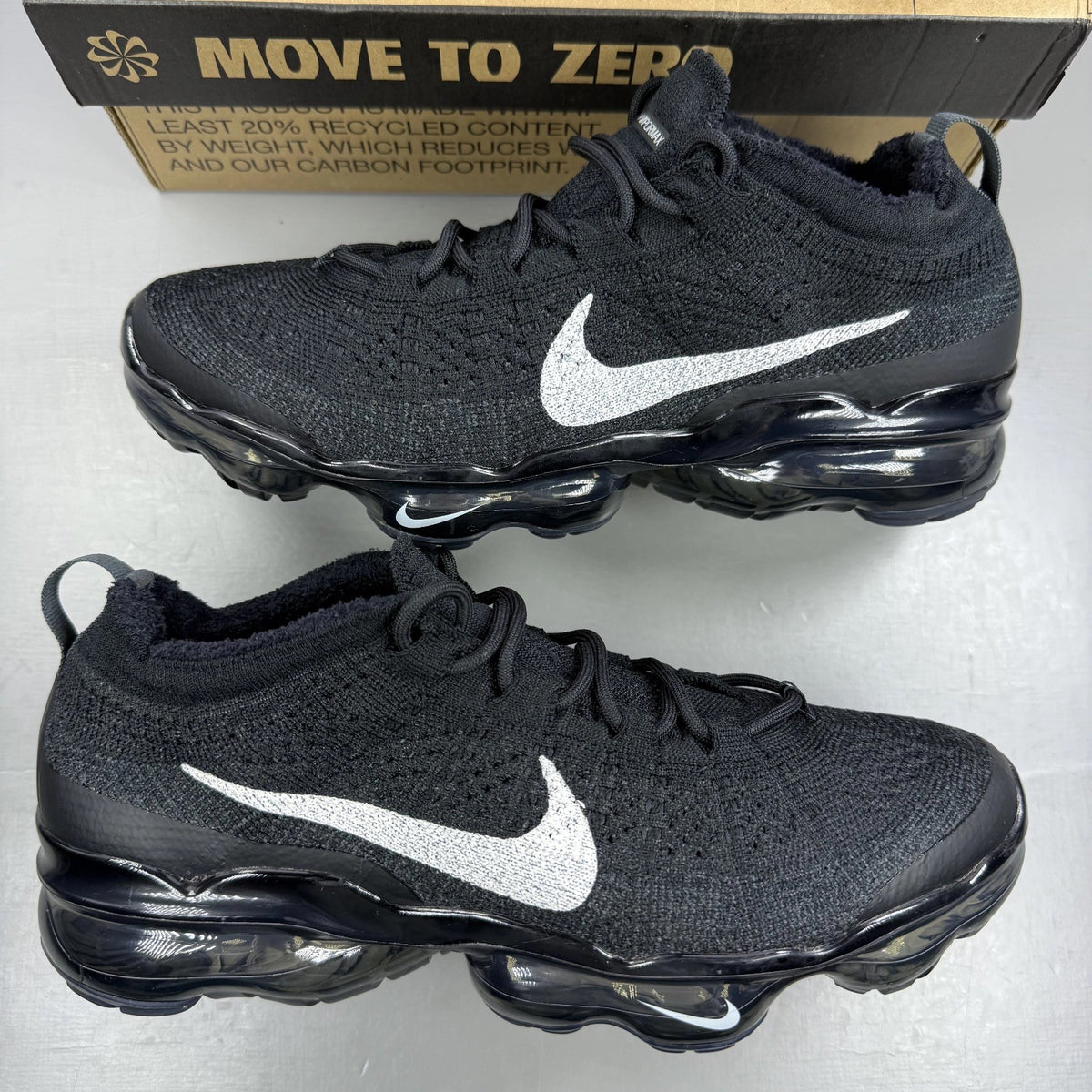 Nike black Air VaporMax trainers with Flyknit upper and signature swoosh logo.