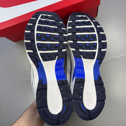 Nike deck shoes grey with blue eclipse accents and white sole, featuring logo detail.