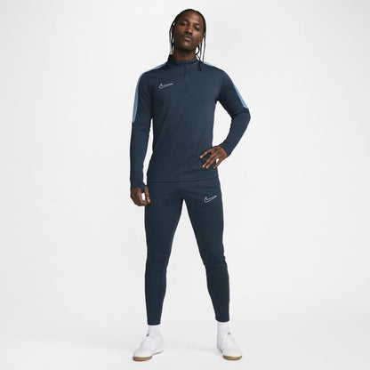 Nike blue Dri-FIT 1/4 zip top with logo and breathable material.