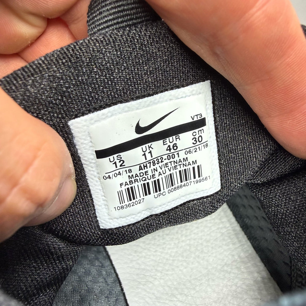 Nike black trainers with Cool Grey accents and Acronym logo details.