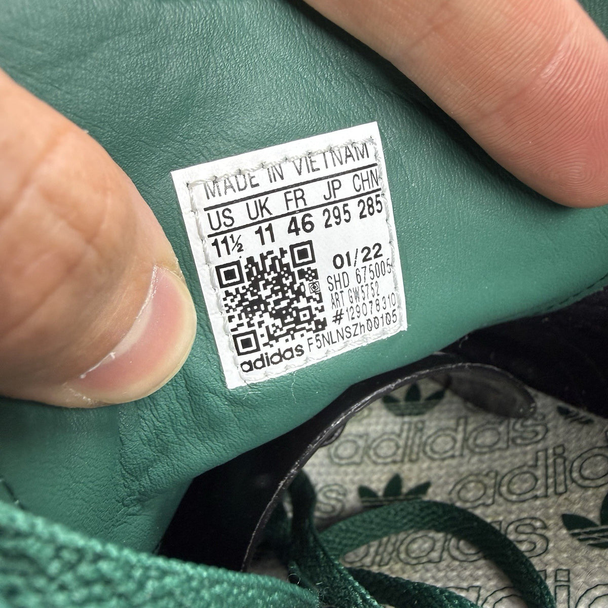 Adidas Hamburg green trainers with gold and yellow accents, featuring classic logo detail.