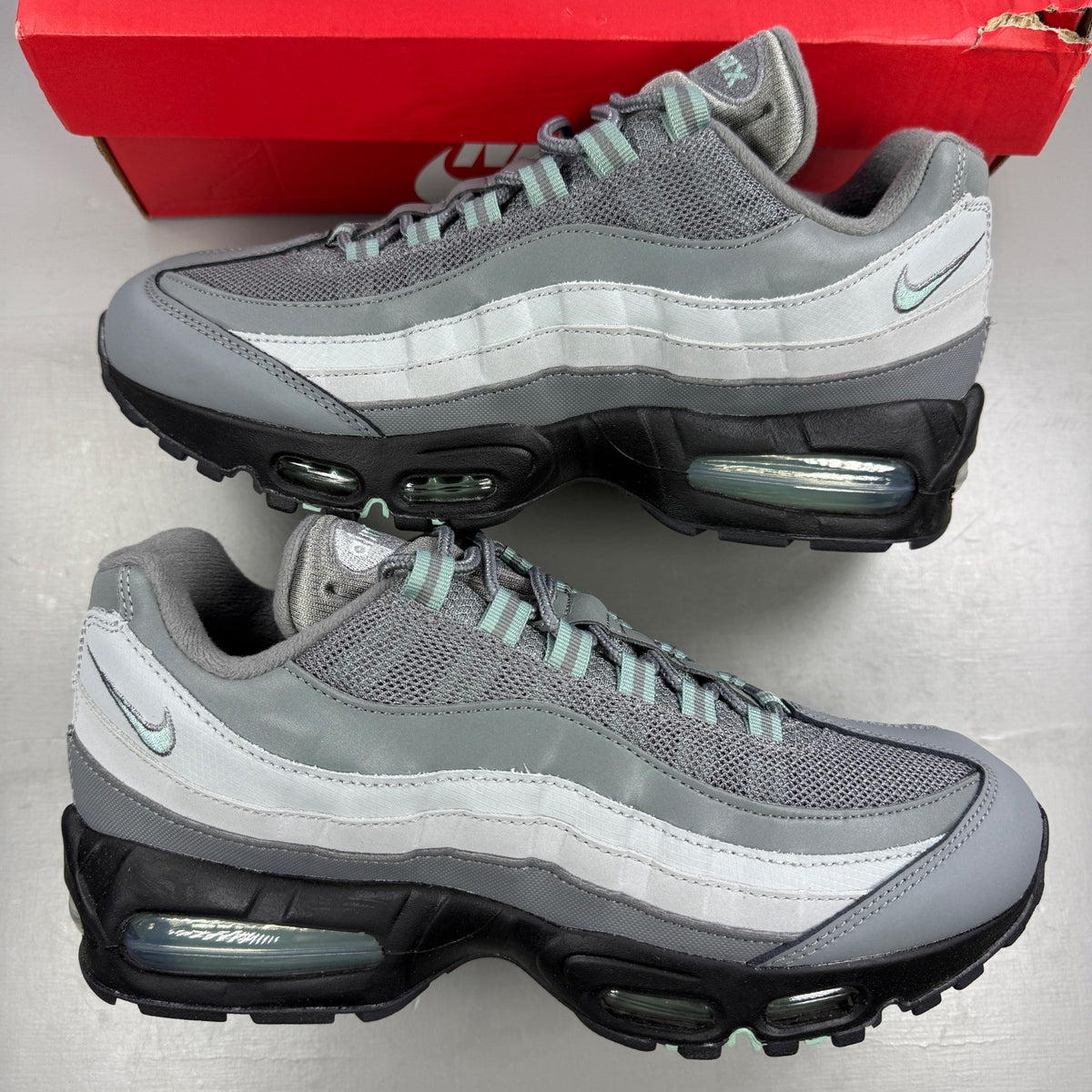 Nike running shoes grey with big bubble design and classic swoosh logo.
