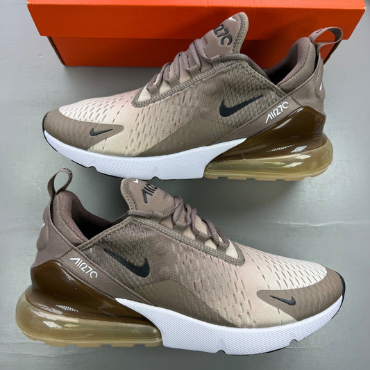 Nike brown trainers with Air Max cushioning and logo detail on the tongue.