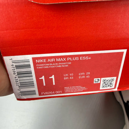 Nike Air Max Plus TN trainers white with black accents and signature logo.