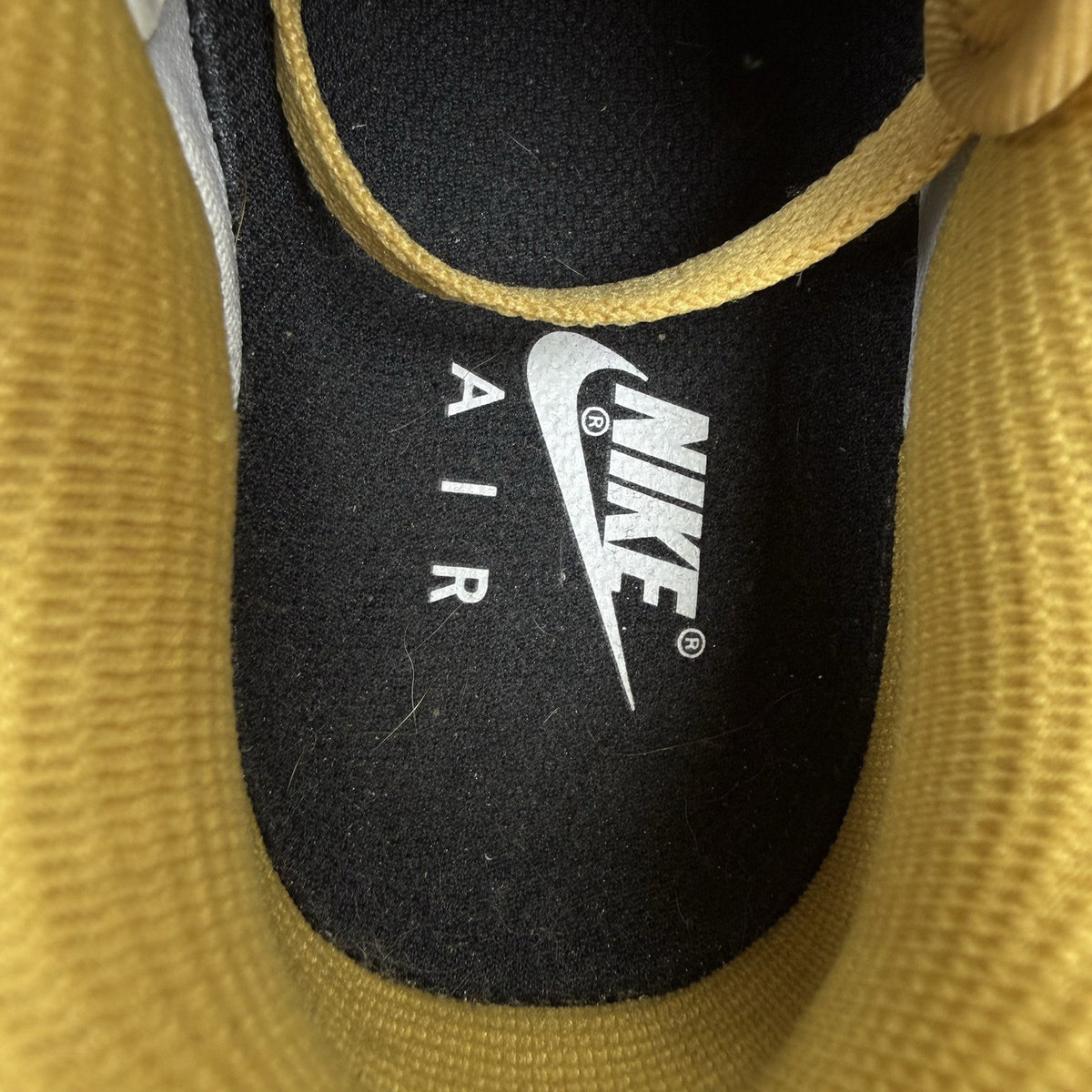 Nike Air Force 1 trainers brown suede upper with gum sole and logo detail.