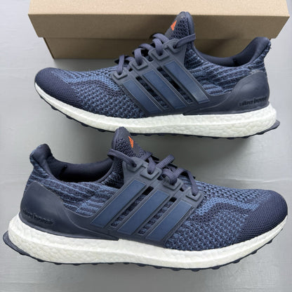 Adidas Ultra Boost 5.0 DNA trainers in navy blue with white accents and logo.
