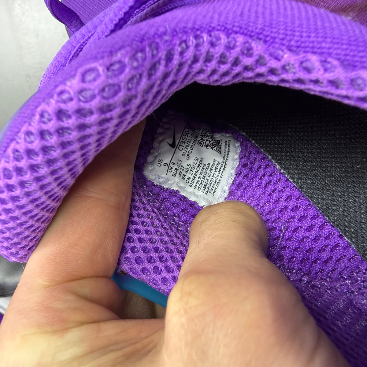 Nike Air Presto purple trainers with mesh upper and distinctive logo detailing.