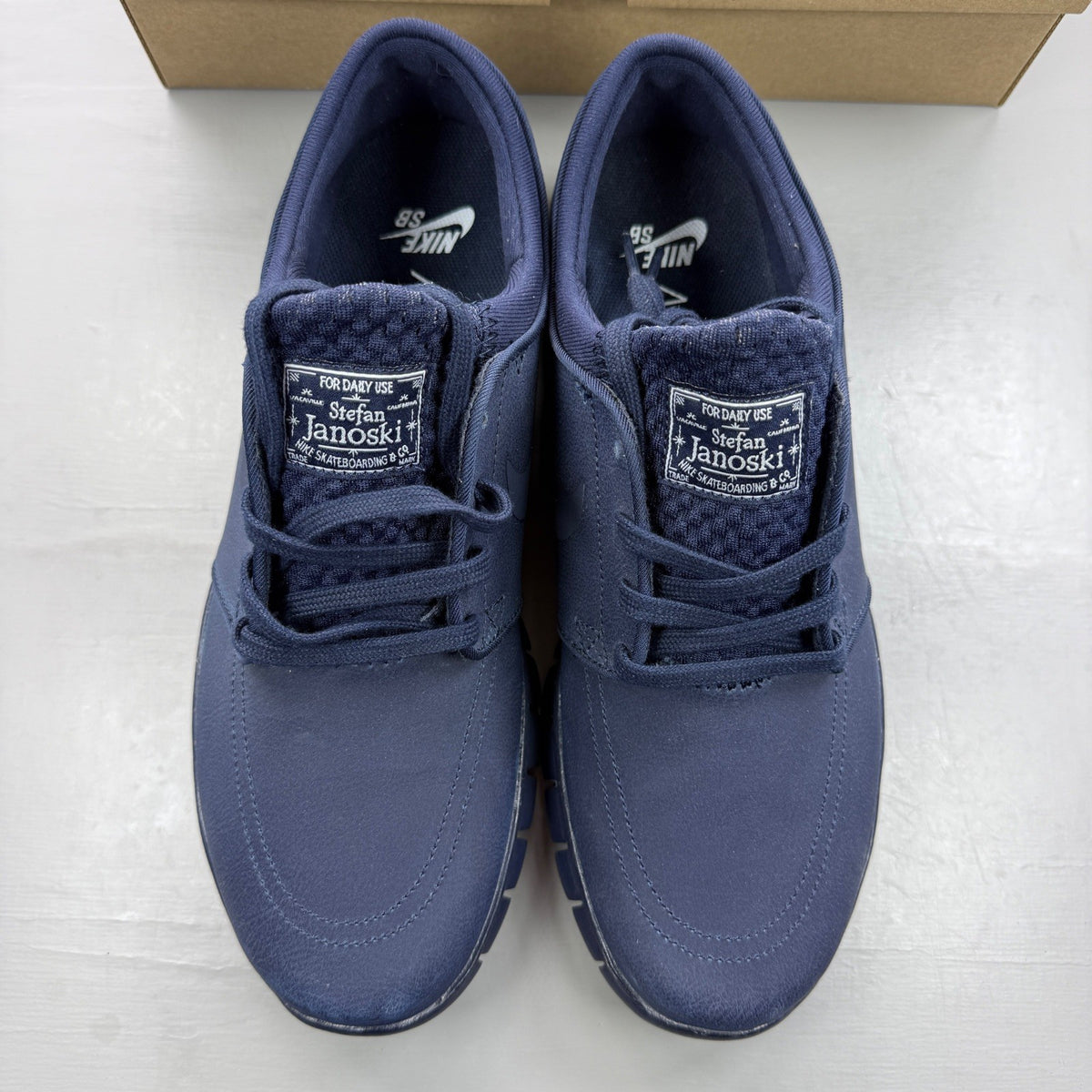Nike deck shoes blue with logo detailing and cushioned sole design.