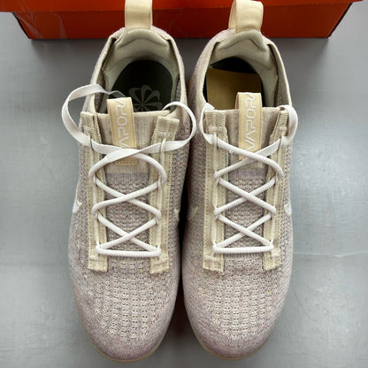 Nike Air VaporMax 2021 FK white trainers with breathable knit upper and signature swoosh logo.