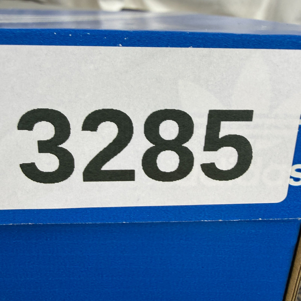 Adidas blue athletic shoes with white accents and textured weave design.