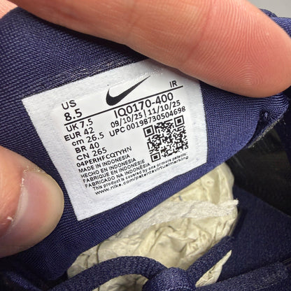 Nike running shoes metallic blue with copper accents and signature logo.