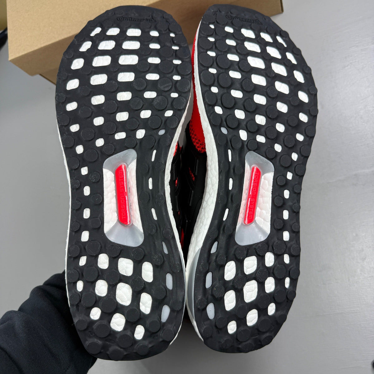 Adidas Ultra Boost trainers multi-colour with mesh upper and signature three stripes logo.