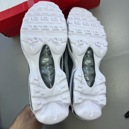Nike Air Max 95 white trainers with grey accents and signature swoosh logo.