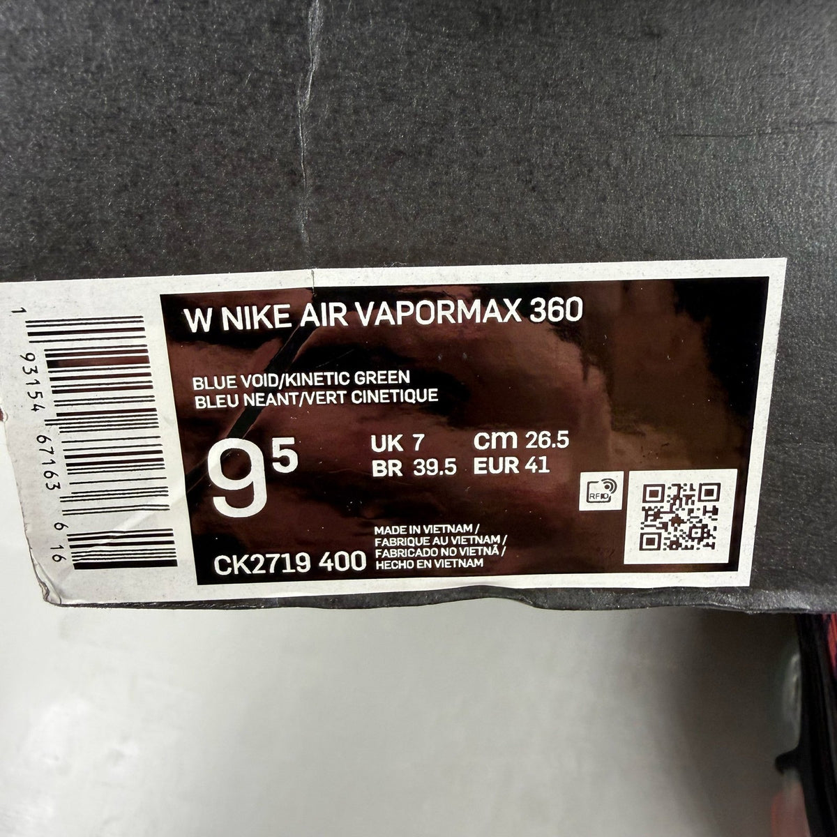 Nike Air VaporMax 360 red trainers with black accents and unique air sole design.