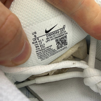 Nike Air Max Plus TN white trainers with blue accents and signature logo.