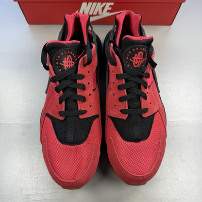 Nike Air Huarache trainers red and black with distinctive logo and unique design details.