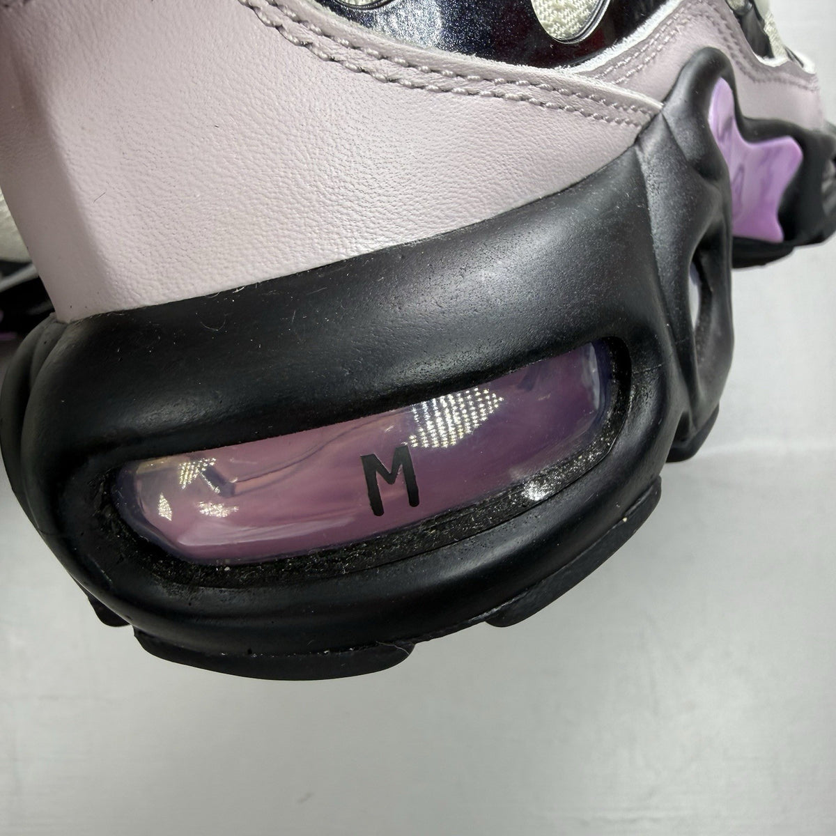 Nike Air Max Plus TN white trainers with black and purple accents, custom writing on bubbles.