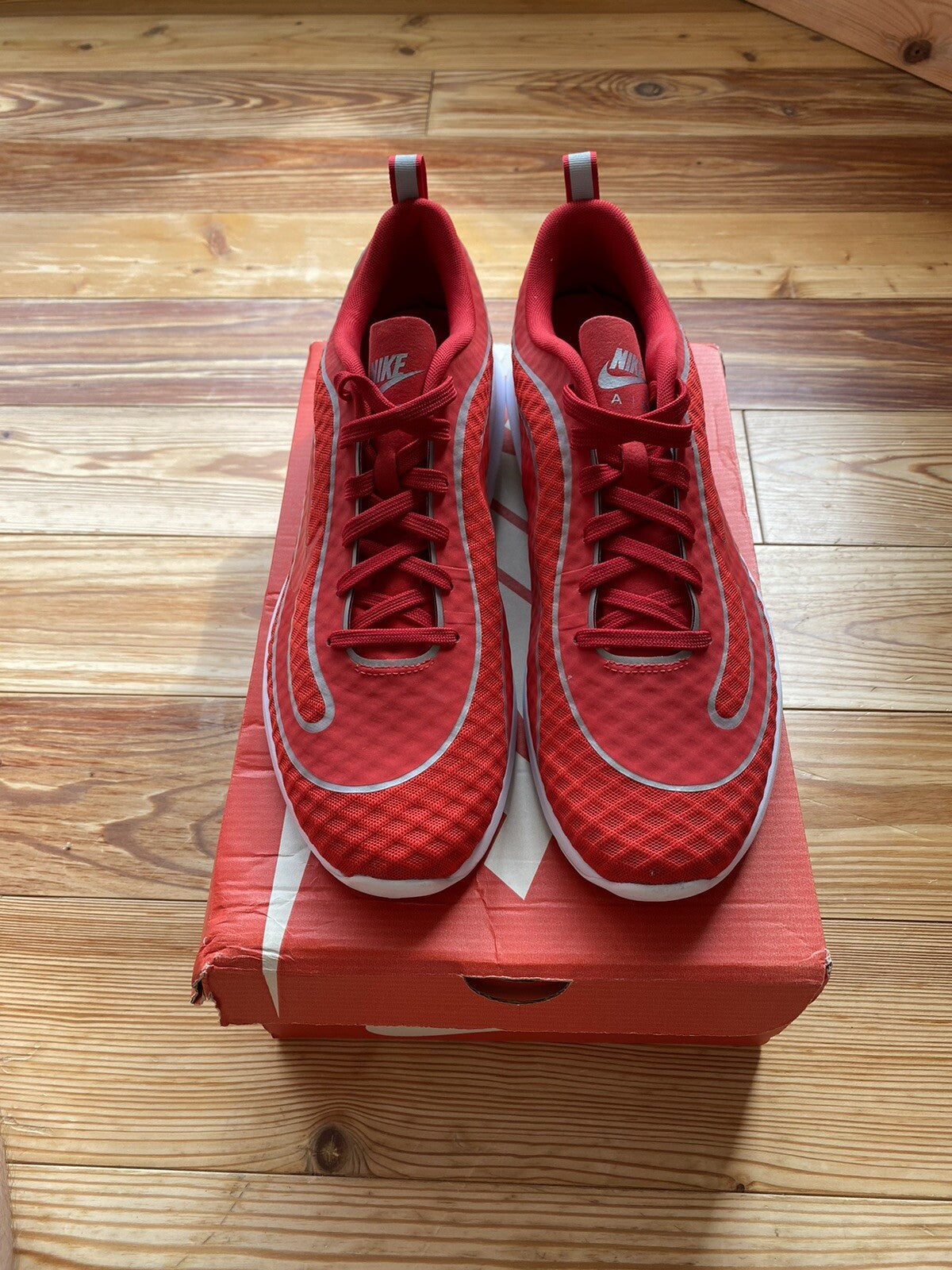 Nike Air Max Mercurial 98 trainers university red with white accents and signature logo.