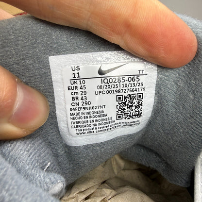 Nike running shoes grey with big bubble sole and reflective detailing.