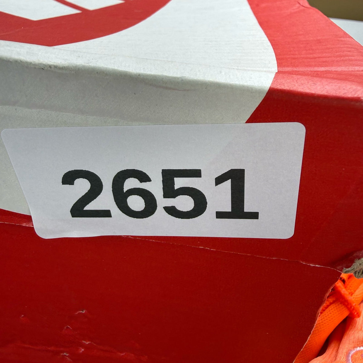 Nike Air Max 95 orange trainers with white overbranding and logo details.