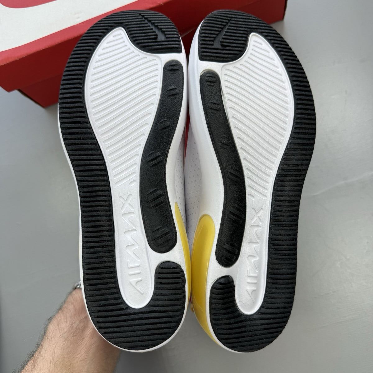 Nike Air Max Dia SE white trainers with laser fuchsia and gold accents, sleek design.