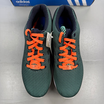 Adidas ZX Flux green trainers with woven texture and night navy accents.