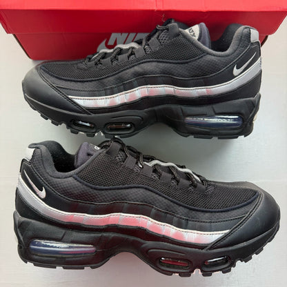 Nike Air Max 95 black sneakers with metallic silver accents and big bubble sole design.