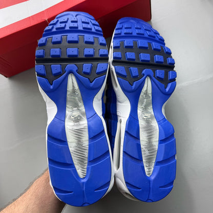 Nike Air Max 95 black trainers with royal blue accents and white detailing.