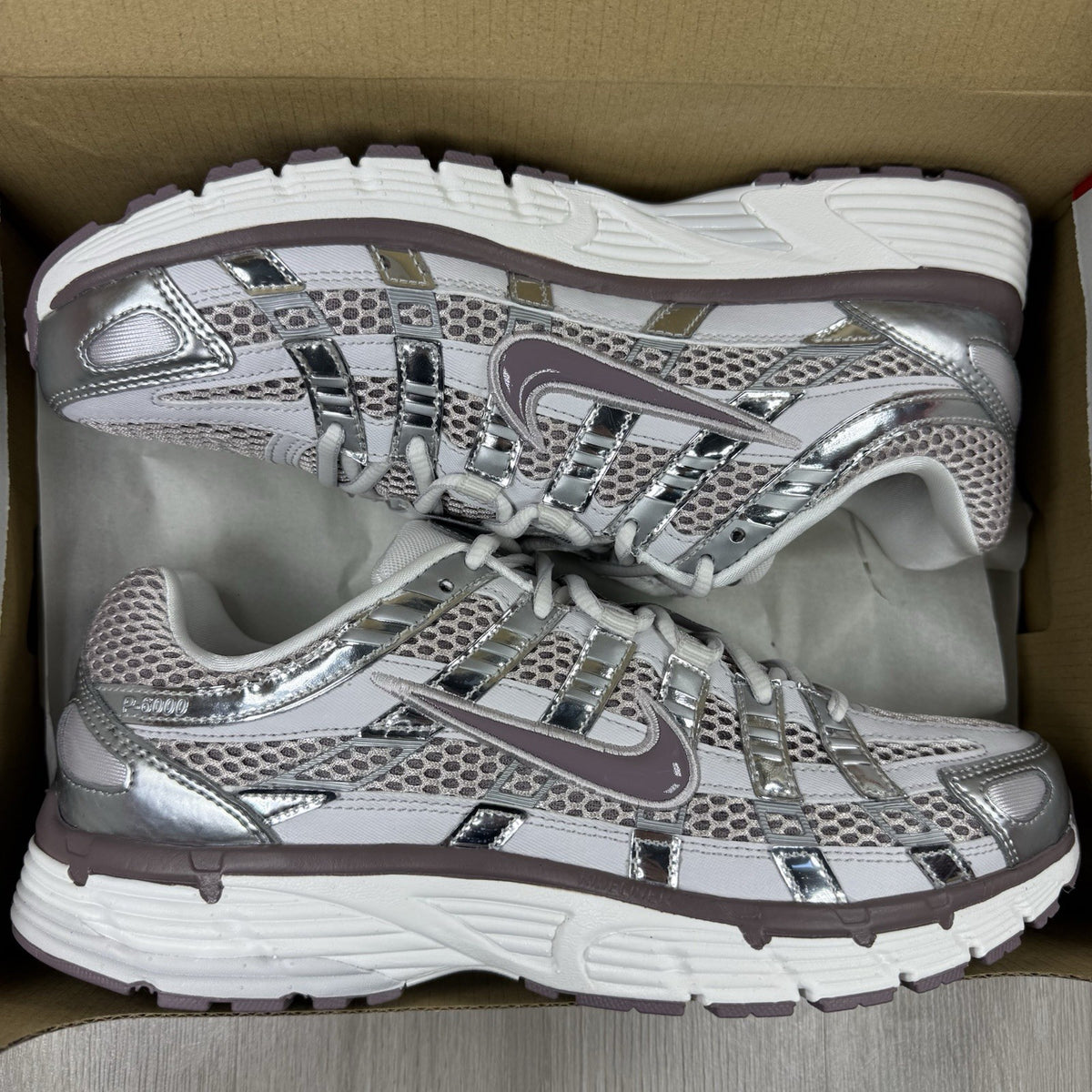 Nike P-6000 trainers grey with platinum violet accents and mesh upper details.