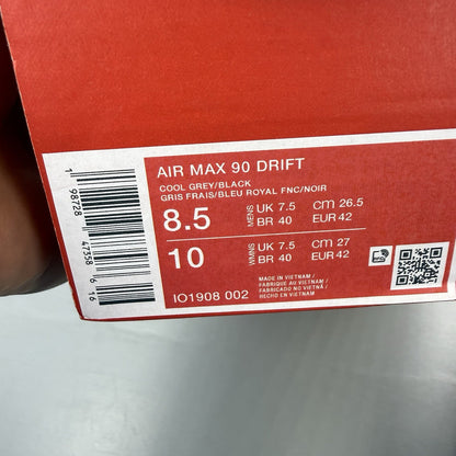 Nike Air Max 90 Drift grey trainers with deep royal blue accents and logo detail.