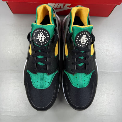 Nike athletic shoes black with emerald green accents and white sole, featuring iconic logo.